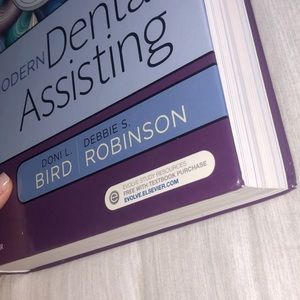 Modern dental assisting 12th Edition + Workbook.